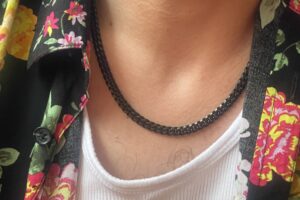 black jewelry necklace on a man